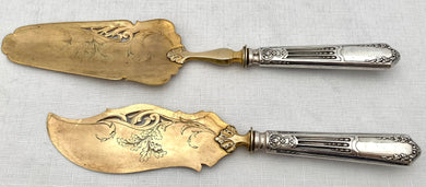 Pair of French Silver Handled Gilt Metal Servers, Circa 1890 - 1910.