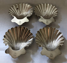 Georgian, set of four Sheffield Plated, crested, butter shell dishes.