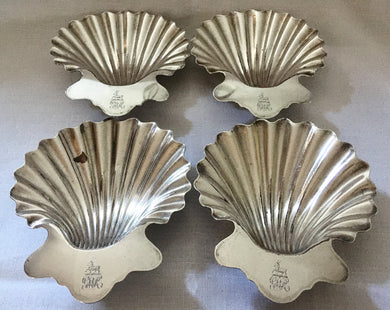 Georgian, set of four Sheffield Plated, crested, butter shell dishes.