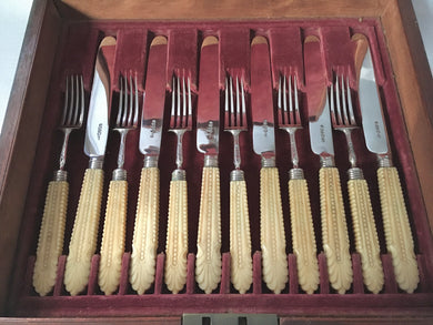 Georgian, George IV, mahogany cased canteen of silver and carved ivory dessert knives and forks for six. Sheffield 1828 George Hardisty.