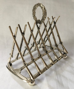 Victorian novelty silver plated toast rack in the form of crossed muskets.