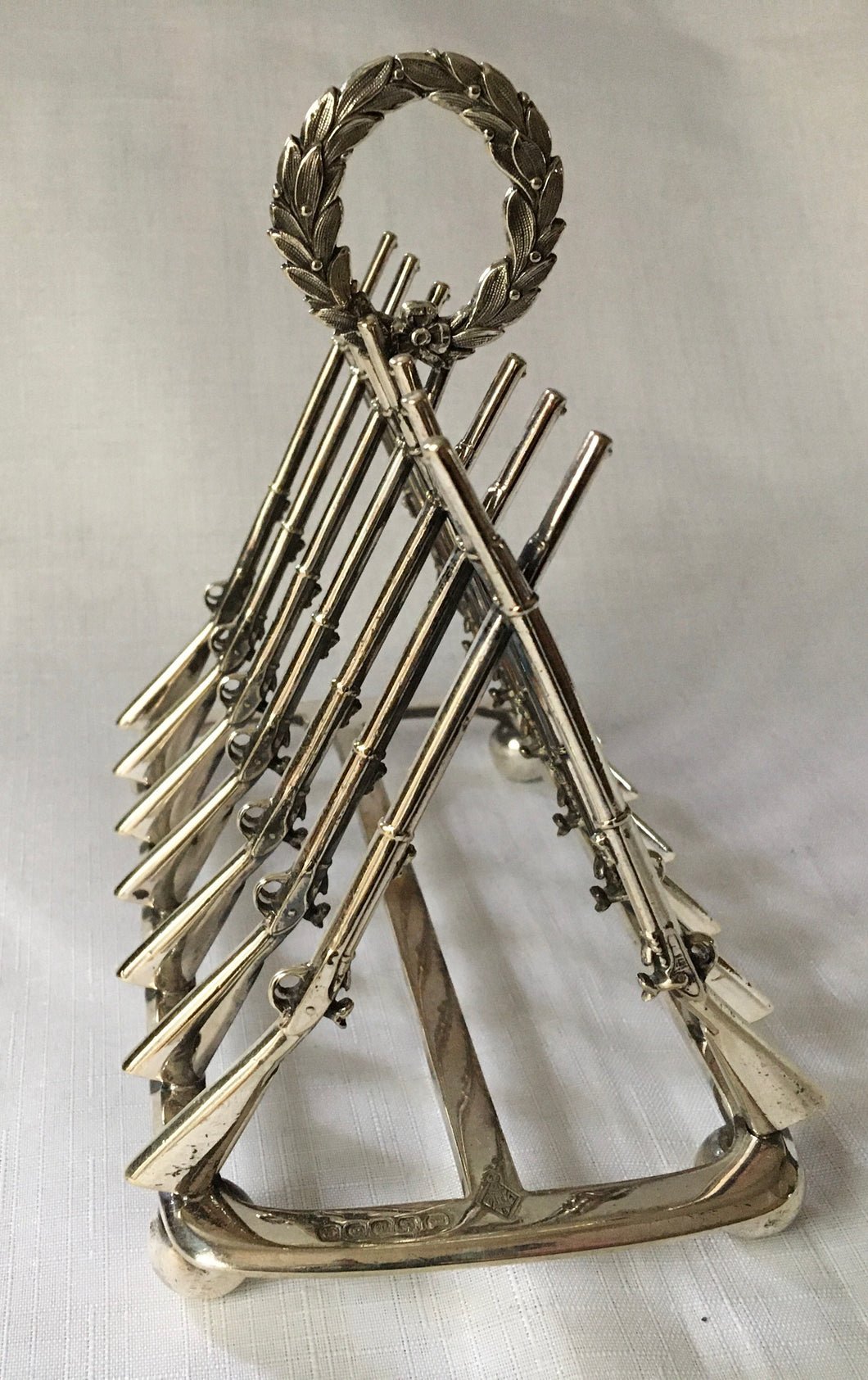 Victorian novelty silver plated toast rack in the form of crossed muskets.