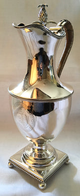 Georgian, George III, silver wine jug with armorial & pineapple finial. London 1776 John Scofield. 22.6 troy ounces.