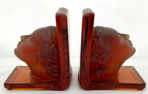 Pair of Art Deco Amber Glass Bookends Depicting Maiden's Heads.