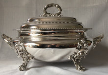 Magnificent 19th century, twin handled, silver plated soup tureen and cover of oval bombe form.