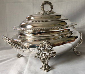 Magnificent 19th century, twin handled, silver plated soup tureen and cover of oval bombe form.