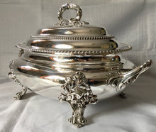 Magnificent 19th century, twin handled, silver plated soup tureen and cover of oval bombe form.