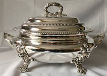 Magnificent 19th century, twin handled, silver plated soup tureen and cover of oval bombe form.