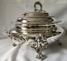 Magnificent 19th century, twin handled, silver plated soup tureen and cover of oval bombe form.