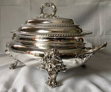 Magnificent 19th century, twin handled, silver plated soup tureen and cover of oval bombe form.