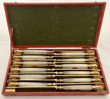 First Half 19th Century Cased Set of Twelve French Silver Gilt, Rose Gold & Carved Mother of Pearl Knives.