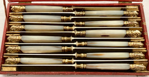 First Half 19th Century Cased Set of Twelve French Silver Gilt, Rose Gold & Carved Mother of Pearl Knives.