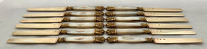 First Half 19th Century Cased Set of Twelve French Silver Gilt, Rose Gold & Carved Mother of Pearl Knives.