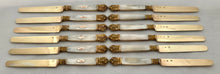 First Half 19th Century Cased Set of Twelve French Silver Gilt, Rose Gold & Carved Mother of Pearl Knives.