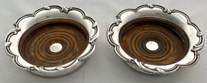 Pair of Late Georgian Old Sheffield Plate Wine Coasters, circa 1820 - 1835.