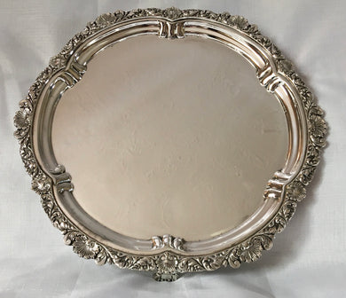 Georgian style, silver plated salver with ornate border & raised on bracket feet.