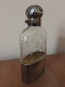 Asprey planished silver gilt and vine etched cut glass hip flask. London 1900 Charles & George Asprey.