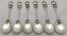 Six Arts & Crafts Coffee Spoons with Entrelac Stems & Seed Pod Terminals.
