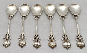 Six Arts & Crafts Coffee Spoons with Entrelac Stems & Seed Pod Terminals.