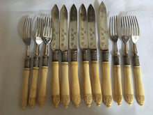 George V, walnut cased 12 person canteen of cutlery with carved ivory handles and silver ferrules. Sheffield 1923 William Hutton & Sons