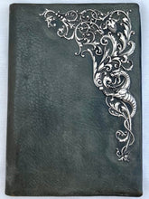 Edwardian Green Leather Blotter Wallet with Ornate White Metal Mount, circa 1900.